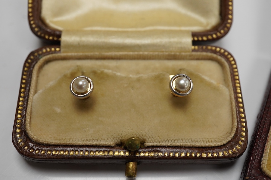 A group of gentleman's accessories, early 20th century, comprising: two pairs of cultured pearl collar studs, one set marked 15CT, each with fitted cases; a stick pin topped with the head of a fox, indistinct mark to pin